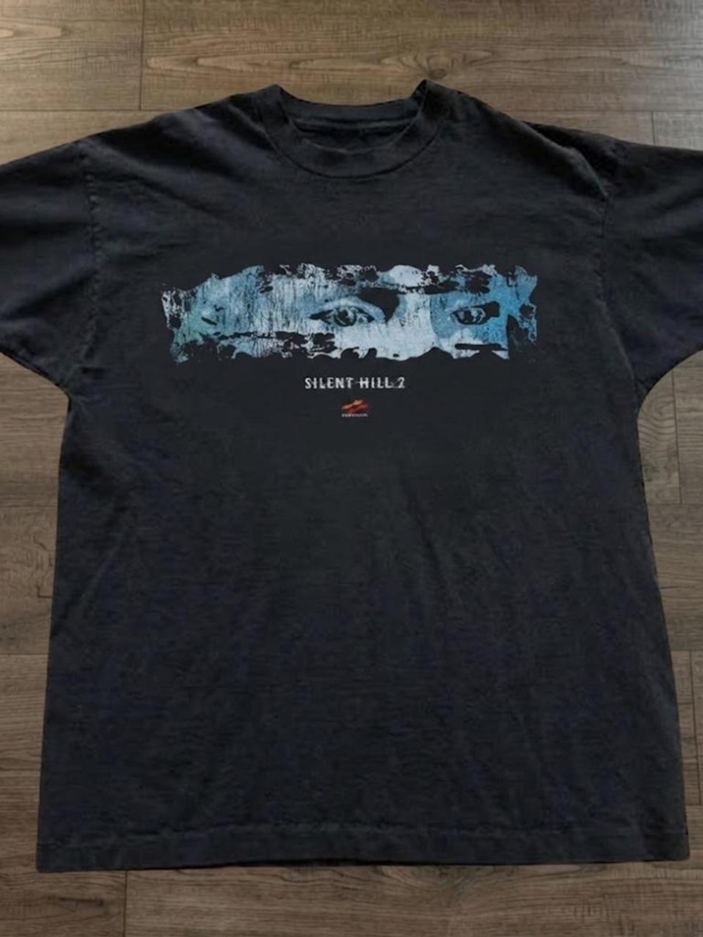 Gildan Black Graphic Tee with Blue Distressed Eye Design